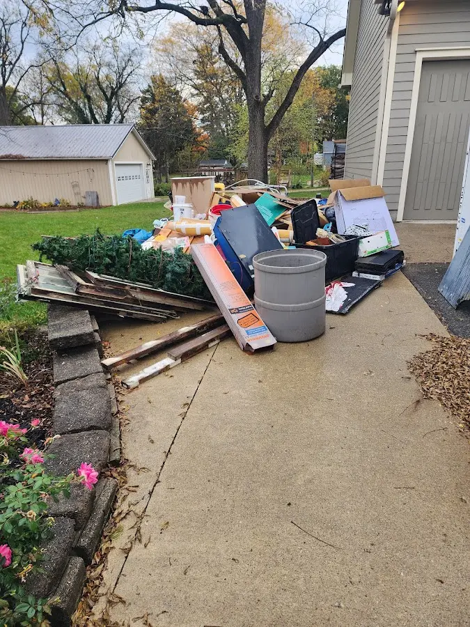 Dumpster being loaded with debris for 3 Yard Dumpster Rental in Bartonsville